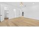 Bright bedroom with hardwood floors, recessed lighting, walk-in closet, and access to an ensuite bathroom at 2753 Camp Branch Rd, Buford, GA 30519