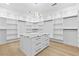 Walk-in closet with custom shelving and central island, offering abundant storage and style at 2753 Camp Branch Rd, Buford, GA 30519