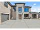 A modern home with a grand entrance, two car garage and contemporary design, featuring a light brick exterior at 2753 Camp Branch Rd, Buford, GA 30519