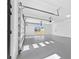 Spacious garage with window and high ceilings; door on opener at 2753 Camp Branch Rd, Buford, GA 30519