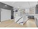 Bright, open kitchen with large marble island, stainless appliances, custom cabinets and view to the exterior at 2753 Camp Branch Rd, Buford, GA 30519