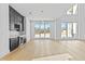 Spacious living room with plenty of light, custom cabinets and wine storage at 2753 Camp Branch Rd, Buford, GA 30519