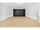 Spacious living area with light wood floors and a built-in entertainment center at 2753 Camp Branch Rd, Buford, GA 30519