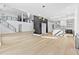 Open concept living room with lots of light, glass staircase and marble kitchen at 2753 Camp Branch Rd, Buford, GA 30519