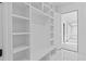 Mudroom with built-in shelves and bench, offering ample storage space at 2753 Camp Branch Rd, Buford, GA 30519