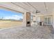 Large covered patio with an outdoor kitchen area and fireplace at 2753 Camp Branch Rd, Buford, GA 30519
