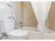 Bathroom with shower/tub combo and white toilet at 1084 Fairburn Nw Rd, Atlanta, GA 30331