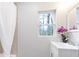 Bright bathroom with a vanity, shower, and window at 1084 Fairburn Nw Rd, Atlanta, GA 30331