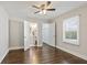 Bright bedroom with hardwood floors, ceiling fan, and ensuite bathroom at 1084 Fairburn Nw Rd, Atlanta, GA 30331
