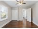Bedroom with hardwood floors, double closet, and ceiling fan at 1084 Fairburn Nw Rd, Atlanta, GA 30331