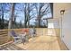 Wooden deck with modern railing and seating area at 1084 Fairburn Nw Rd, Atlanta, GA 30331