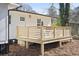 Wooden deck with modern railings attached to a white house at 1084 Fairburn Nw Rd, Atlanta, GA 30331