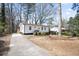 Quaint house with a long driveway and mature trees at 1084 Fairburn Nw Rd, Atlanta, GA 30331