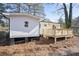 White house exterior with wooden deck and fenced backyard at 1084 Fairburn Nw Rd, Atlanta, GA 30331