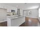 Updated kitchen featuring white cabinets, granite counters, and hardwood floors at 1084 Fairburn Nw Rd, Atlanta, GA 30331