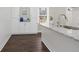 White kitchen cabinets, granite countertops and hardwood floors at 1084 Fairburn Nw Rd, Atlanta, GA 30331