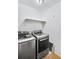 Laundry area with washer, dryer, and additional shelving at 2006 Augusta Se Dr, Marietta, GA 30067