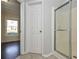 Tiled bathroom featuring a glass-enclosed shower with tile flooring at 54 Etham Pl, Douglasville, GA 30134