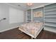 Bedroom showcasing custom built-in shelving and a cozy window seat at 54 Etham Pl, Douglasville, GA 30134