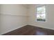 Empty closet with hardwood floors and a window view of the yard at 54 Etham Pl, Douglasville, GA 30134