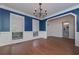 Open-concept dining area with wainscotting, natural light, and hardwood flooring at 54 Etham Pl, Douglasville, GA 30134