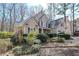 Charming two-story home with beige siding, red shutters, a well-maintained lawn, and mature trees at 54 Etham Pl, Douglasville, GA 30134