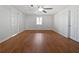 Spacious basement room with wood flooring and ceiling fan at 60 Legend Creek Holw, Douglasville, GA 30134