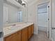 Bathroom with double vanity and neutral tile flooring at 60 Legend Creek Holw, Douglasville, GA 30134