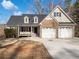 Brick and siding two-story house with a two-car garage and landscaped yard at 60 Legend Creek Holw, Douglasville, GA 30134