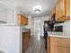 Modern kitchen with wood cabinets, and neutral countertops at 60 Legend Creek Holw, Douglasville, GA 30134