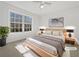 Virtually staged bedroom with large windows and plush bedding at 60 Legend Creek Holw, Douglasville, GA 30134