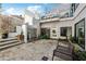 Inviting backyard featuring a private patio with a water feature and stylish bench at 727 Berkeley Nw Ave, Atlanta, GA 30318