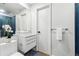Modern bathroom showcasing a floating vanity with a vessel sink and a blue tiled shower at 727 Berkeley Nw Ave, Atlanta, GA 30318