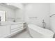Bright bathroom with a soaking tub, modern vanity, and elegant fixtures at 727 Berkeley Nw Ave, Atlanta, GA 30318