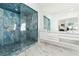 Stunning bathroom featuring a glass walk-in shower with blue tile and floating vanity at 727 Berkeley Nw Ave, Atlanta, GA 30318