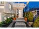 Elegant entrance featuring stone steps, manicured landscaping, and a pergola-covered walkway to the front door at 727 Berkeley Nw Ave, Atlanta, GA 30318