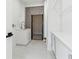 Well-lit laundry room with modern appliances, ample storage, and neutral color scheme at 727 Berkeley Nw Ave, Atlanta, GA 30318