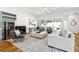 Bright living room with fireplace, modern furniture, neutral colors, and lots of light at 727 Berkeley Nw Ave, Atlanta, GA 30318