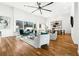 Bright living room with hardwood floors, high ceilings, large windows, and stylish contemporary furniture at 727 Berkeley Nw Ave, Atlanta, GA 30318