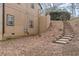 View of the backyard showing terraced landscape with stairway and back of house at 3847 Admiral Dr, Chamblee, GA 30341