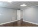 Spacious finished basement has hard wood floors, neutral paint, textured ceiling and access to other rooms at 3847 Admiral Dr, Chamblee, GA 30341