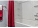 Bathroom featuring a tub/shower combo with red curtain at 3847 Admiral Dr, Chamblee, GA 30341