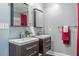 Bathroom with dual sinks, modern fixtures, and sleek vanities at 3847 Admiral Dr, Chamblee, GA 30341