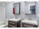 Bathroom featuring dual vanities with modern faucets and dark wood cabinetry at 3847 Admiral Dr, Chamblee, GA 30341