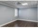 Bedroom with hardwood floors, window with shutters, and paneled ceiling at 3847 Admiral Dr, Chamblee, GA 30341