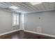Bedroom featuring hardwood floors, paneled ceiling, and a light gray paint at 3847 Admiral Dr, Chamblee, GA 30341