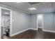 Bedroom featuring hardwood floors leading to the stairs and walk-in closet at 3847 Admiral Dr, Chamblee, GA 30341
