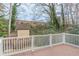 Wood deck overlooking a fenced yard with shed and mature trees at 3847 Admiral Dr, Chamblee, GA 30341