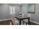 Dining room with modern table set, white trim, and neutral wall color at 3847 Admiral Dr, Chamblee, GA 30341