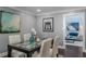 Dining room with view into living room, white trim, and neutral wall color at 3847 Admiral Dr, Chamblee, GA 30341